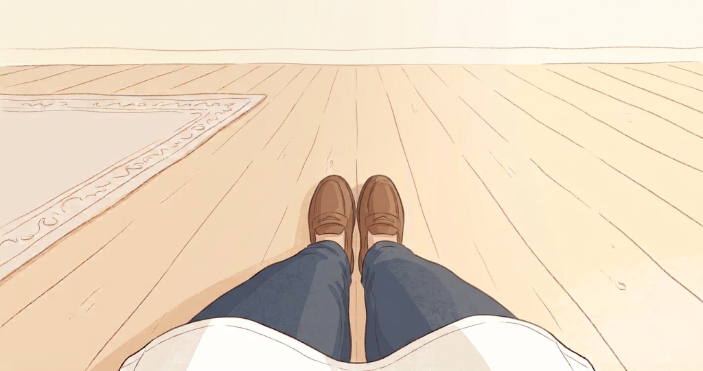 椅子に座って両足のつま先の向きを確かめる様子